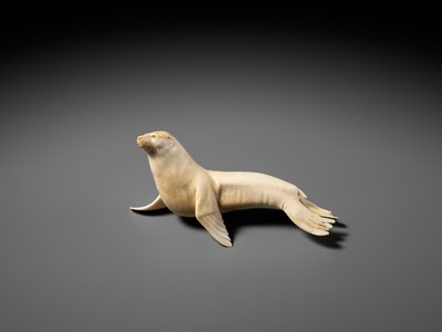 Lot 149 - ITASAKA KASON: A VERY RARE IVORY OKIMONO DEPICTING A RECUMBENT SEA LION
