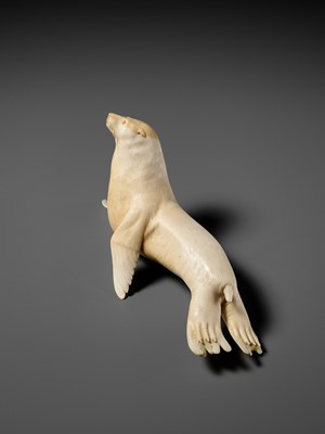 Lot 149 - ITASAKA KASON: A VERY RARE IVORY OKIMONO DEPICTING A RECUMBENT SEA LION
