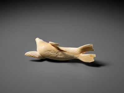Lot 149 - ITASAKA KASON: A VERY RARE IVORY OKIMONO DEPICTING A RECUMBENT SEA LION