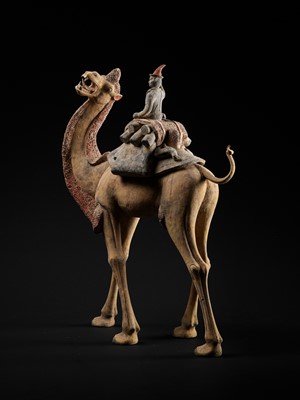 Lot 66 - AN EXCEPTIONALLY LARGE PAINTED POTTERY FIGURE OF A BACTRIAN CAMEL AND A SOGDIAN RIDER, TANG DYNASTY