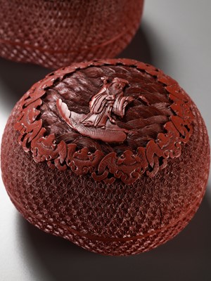 Lot 7 - A PAIR OF HEAVY CARVED CINNABAR LACQUER PEACH-FORM BOXES AND COVERS DEPICTING IMMORTALS, QIANLONG PERIOD