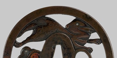 Lot 292 - SHOAMI YUKIMITSU: A FINE SHIBUICHI TSUBA DEPICTING THE WHITE HARE OF INABA LEAPING OVER WAVES