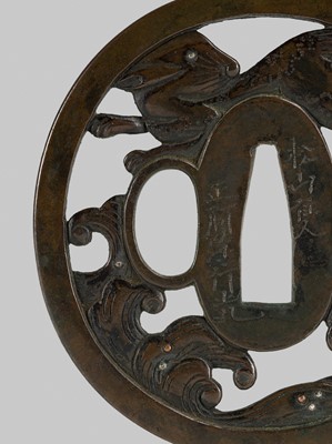 Lot 292 - SHOAMI YUKIMITSU: A FINE SHIBUICHI TSUBA DEPICTING THE WHITE HARE OF INABA LEAPING OVER WAVES