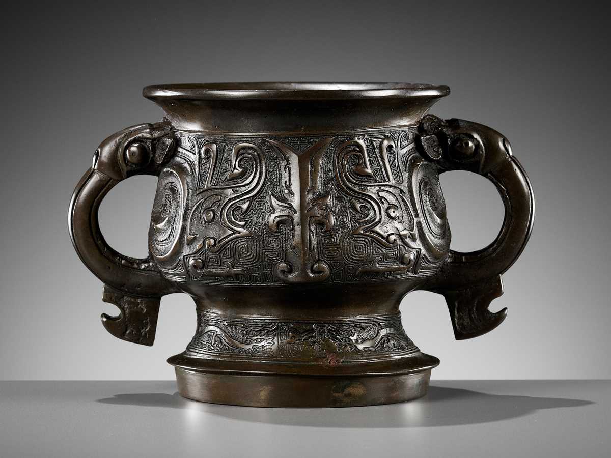 Lot 324 - AN ARCHAISTIC BRONZE GUI-FORM CENSER,