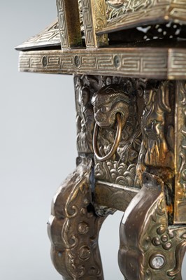 A GILT COPPER REPOUSSÉ CENSER AND RETICULATED COVER, FANGDING, QING DYNASTY