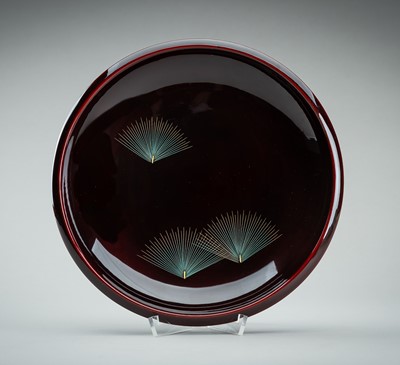 Lot 228 - YONENAGA: A BURGUNDY LACQUER DISH