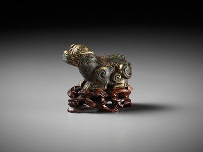 Lot 163 - A GILT BRONZE LION-FORM WEIGHT, LATE MING DYNASTY