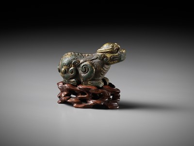 Lot 163 - A GILT BRONZE LION-FORM WEIGHT, LATE MING DYNASTY