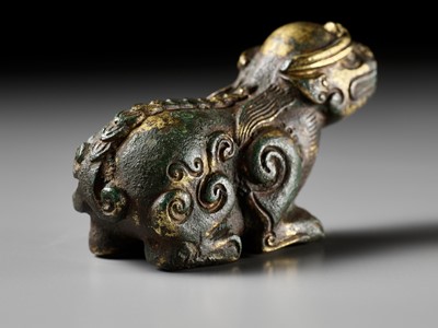 Lot 163 - A GILT BRONZE LION-FORM WEIGHT, LATE MING DYNASTY