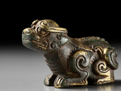 Lot 163 - A GILT BRONZE LION-FORM WEIGHT, LATE MING DYNASTY