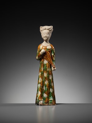 Lot 62 - A SANCAI GLAZED POTTERY FIGURE OF A FEMALE MUSICIAN PLAYING THE PIPA, TANG DYNASTY