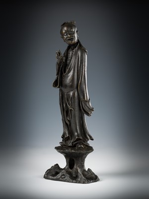 Lot 71 - A BRONZE FIGURE OF AN IMMORTAL, LATE MING DYNASTY
