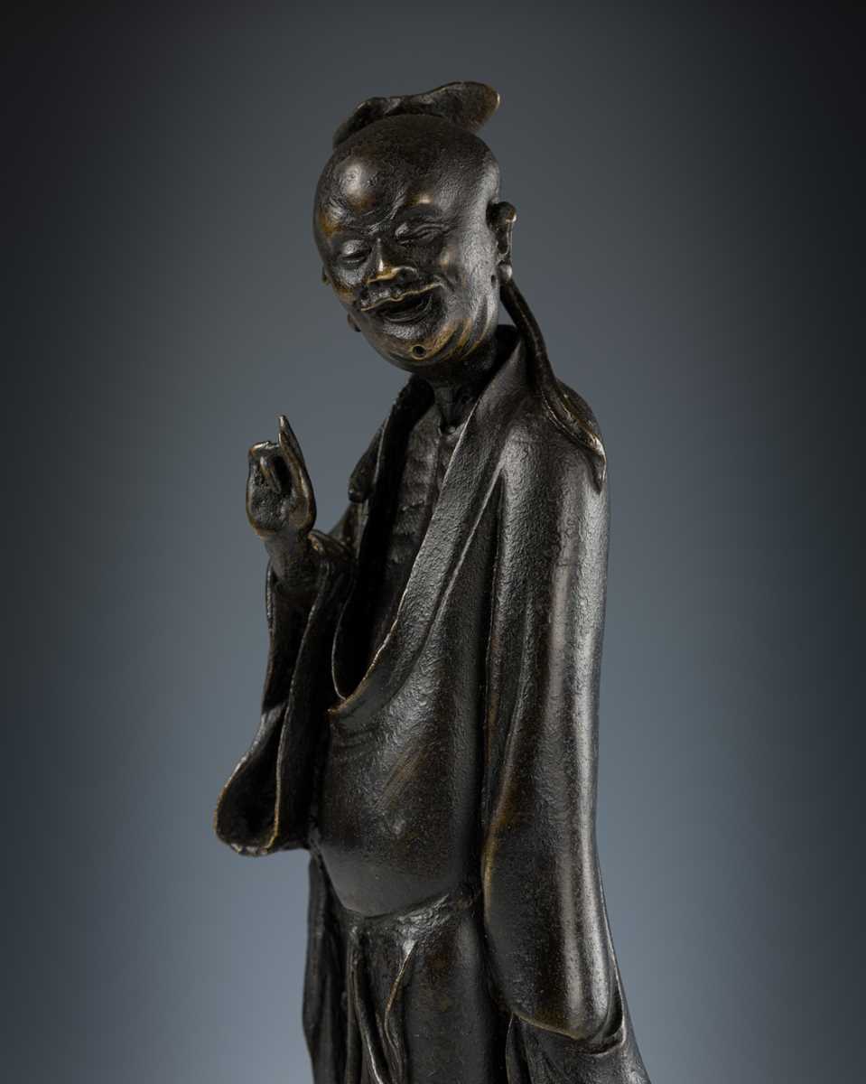 Lot 71 - A BRONZE FIGURE OF AN IMMORTAL, LATE MING DYNASTY