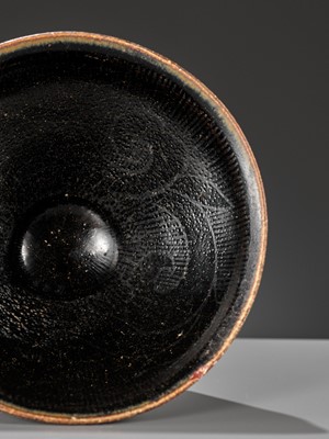 Lot 144 - A CIZHOU SILVER-DECORATED AND BLACK-GLAZED TEA BOWL, SOUTHERN SONG OR JIN DYNASTY