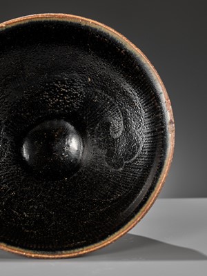 Lot 144 - A CIZHOU SILVER-DECORATED AND BLACK-GLAZED TEA BOWL, SOUTHERN SONG OR JIN DYNASTY