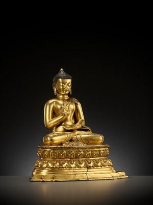 Lot 179 - A GILT COPPER ALLOY FIGURE OF AMOGHASIDDHI, ONE OF THE FIVE WISDOM BUDDHAS, POSSIBLY DENSATIL, TIBET, 14TH-15TH CENTURY