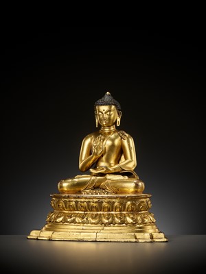 Lot 179 - A GILT COPPER ALLOY FIGURE OF AMOGHASIDDHI, ONE OF THE FIVE WISDOM BUDDHAS, POSSIBLY DENSATIL, TIBET, 14TH-15TH CENTURY