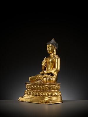 Lot 179 - A GILT COPPER ALLOY FIGURE OF AMOGHASIDDHI, ONE OF THE FIVE WISDOM BUDDHAS, POSSIBLY DENSATIL, TIBET, 14TH-15TH CENTURY