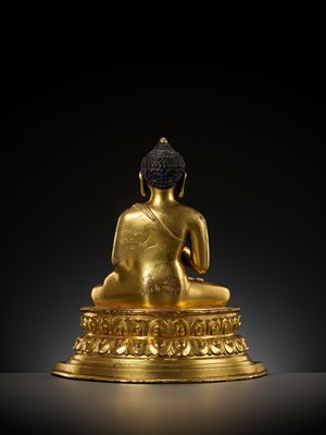 Lot 179 - A GILT COPPER ALLOY FIGURE OF AMOGHASIDDHI, ONE OF THE FIVE WISDOM BUDDHAS, POSSIBLY DENSATIL, TIBET, 14TH-15TH CENTURY