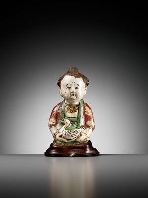 Lot 74 - A CIZHOU POTTERY FIGURE OF A BOY WITH A DUCK, SONG TO YUAN DYNASTY