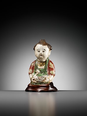 Lot 74 - A CIZHOU POTTERY FIGURE OF A BOY WITH A DUCK, SONG TO YUAN DYNASTY