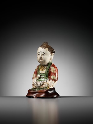 Lot 74 - A CIZHOU POTTERY FIGURE OF A BOY WITH A DUCK, SONG TO YUAN DYNASTY