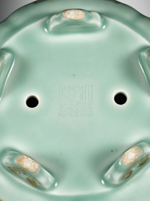 Lot 114 - A MOLDED, LOBED AND GILT CELADON-GLAZED JARDINIÈRE, QIANLONG MARK AND PERIOD