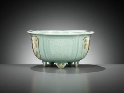 Lot 114 - A MOLDED, LOBED AND GILT CELADON-GLAZED JARDINIÈRE, QIANLONG MARK AND PERIOD