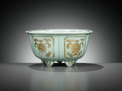 Lot 114 - A MOLDED, LOBED AND GILT CELADON-GLAZED JARDINIÈRE, QIANLONG MARK AND PERIOD