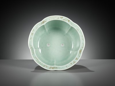 Lot 114 - A MOLDED, LOBED AND GILT CELADON-GLAZED JARDINIÈRE, QIANLONG MARK AND PERIOD