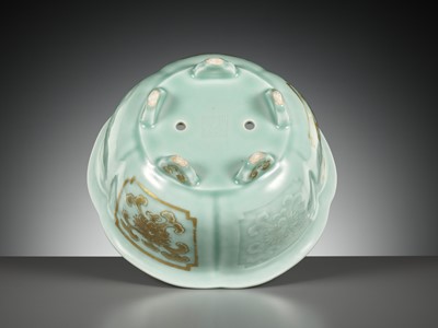 Lot 114 - A MOLDED, LOBED AND GILT CELADON-GLAZED JARDINIÈRE, QIANLONG MARK AND PERIOD