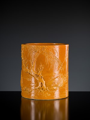 A carved and moulded yellow-glazed brushpot, bitong, 19th century