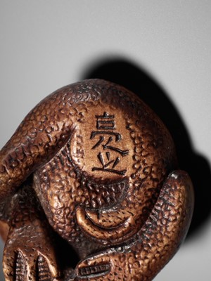 Lot 194 - SUKEYUKI: A SUPERB WOOD NETSUKE OF A LONG-HAIRED KAPPA