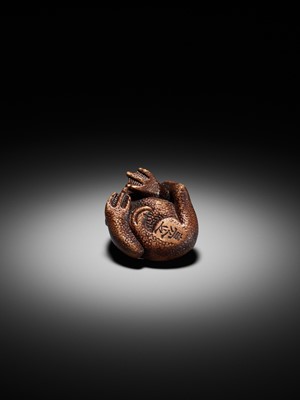 Lot 194 - SUKEYUKI: A SUPERB WOOD NETSUKE OF A LONG-HAIRED KAPPA