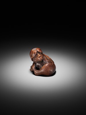 Lot 194 - SUKEYUKI: A SUPERB WOOD NETSUKE OF A LONG-HAIRED KAPPA