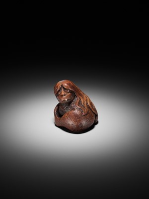 Lot 194 - SUKEYUKI: A SUPERB WOOD NETSUKE OF A LONG-HAIRED KAPPA