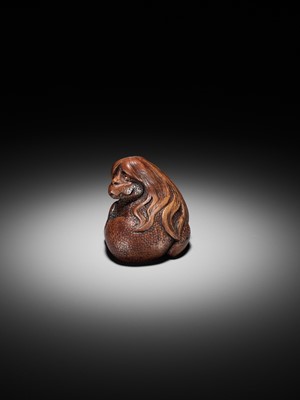 Lot 194 - SUKEYUKI: A SUPERB WOOD NETSUKE OF A LONG-HAIRED KAPPA