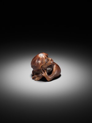 Lot 194 - SUKEYUKI: A SUPERB WOOD NETSUKE OF A LONG-HAIRED KAPPA