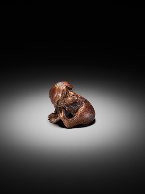 Lot 194 - SUKEYUKI: A SUPERB WOOD NETSUKE OF A LONG-HAIRED KAPPA