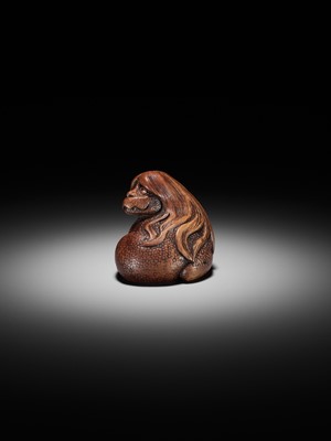 Lot 194 - SUKEYUKI: A SUPERB WOOD NETSUKE OF A LONG-HAIRED KAPPA