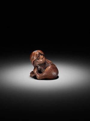 Lot 194 - SUKEYUKI: A SUPERB WOOD NETSUKE OF A LONG-HAIRED KAPPA