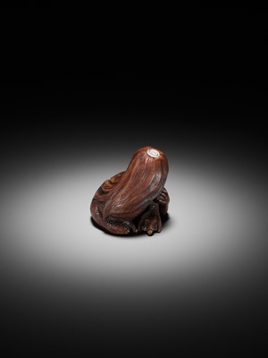 Lot 194 - SUKEYUKI: A SUPERB WOOD NETSUKE OF A LONG-HAIRED KAPPA