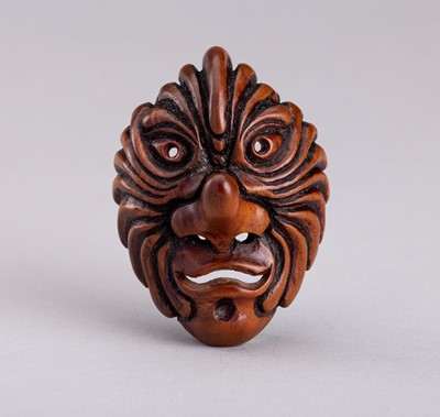 Lot 843 - A BESHIMI WOOD MASK NETSUKE