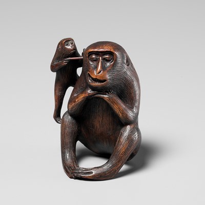 Lot 259 - HARUMITSU: AN AMUSING WOOD OKIMONO DEPICTING TWO MONKEYS