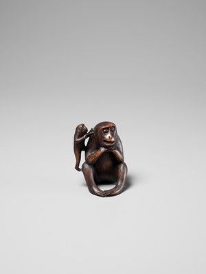 Lot 259 - HARUMITSU: AN AMUSING WOOD OKIMONO DEPICTING TWO MONKEYS