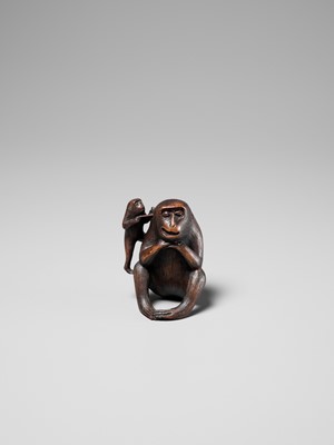 Lot 259 - HARUMITSU: AN AMUSING WOOD OKIMONO DEPICTING TWO MONKEYS