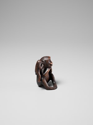 Lot 259 - HARUMITSU: AN AMUSING WOOD OKIMONO DEPICTING TWO MONKEYS