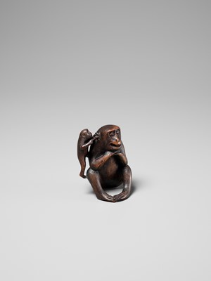 Lot 259 - HARUMITSU: AN AMUSING WOOD OKIMONO DEPICTING TWO MONKEYS