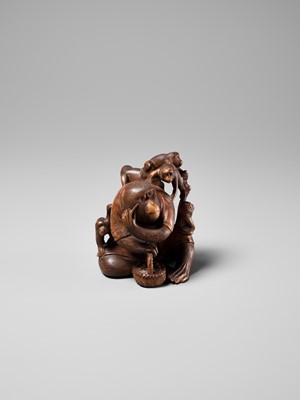 Lot 258 - KOGETSU: A WOOD OKIMONO OF A ROBED MONKEY WITH SEVERAL YOUNG