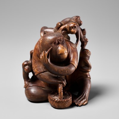 Lot 258 - KOGETSU: A WOOD OKIMONO OF A ROBED MONKEY WITH SEVERAL YOUNG